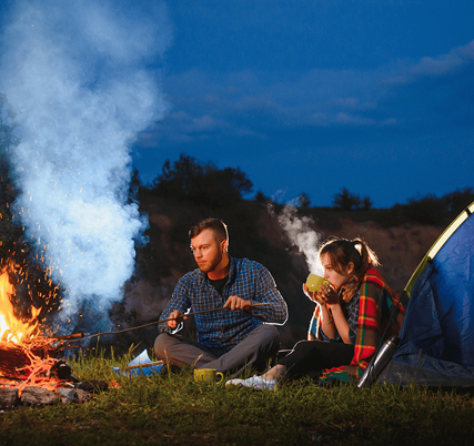 Couple camping at dusk